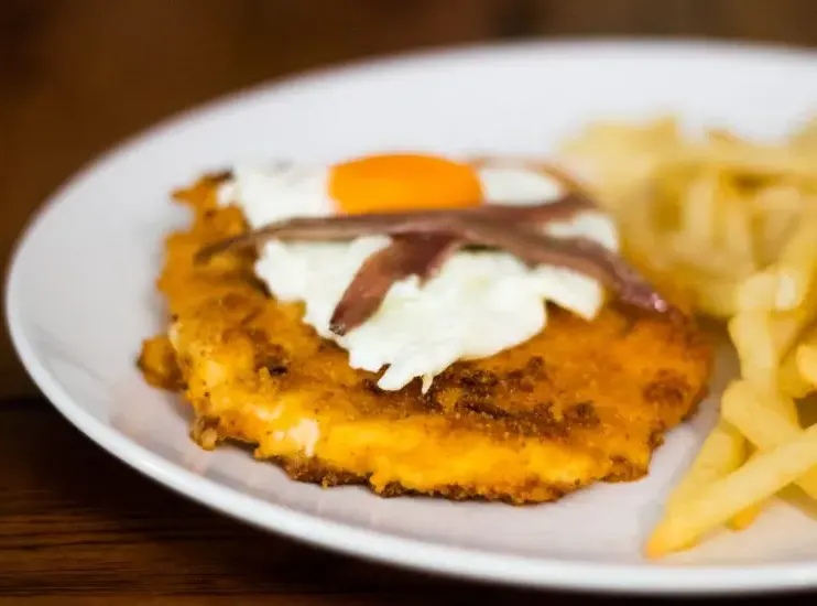 Doritos-Coated-Schnitzel-with-Fried-Eggs-and-Anchovies