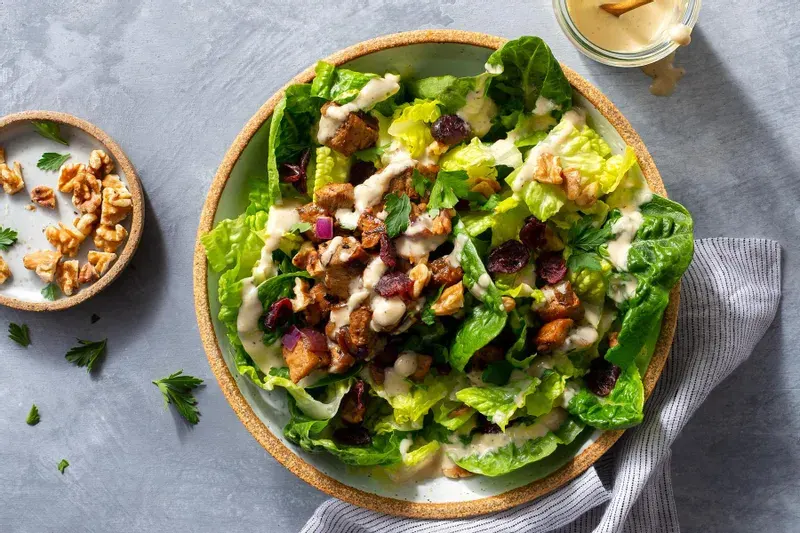 pork-chop-salad-with-dried-cranberries-walnuts-and-caesar-dressing