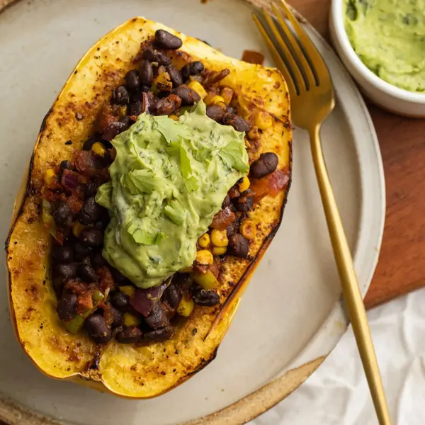 vegan-black-bean-and-corn-stuffed-spaghetti-squash-with-avocado-crema